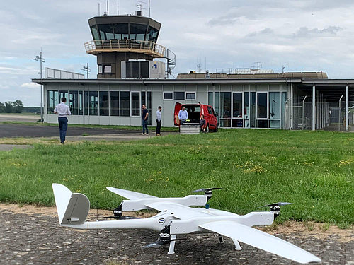 VTOL UAV with control tower in the background